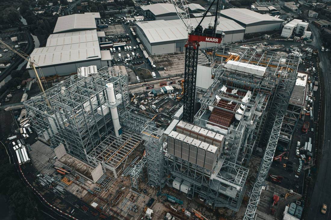 Aerial of energy-from-waste plant steelwork with tower crane