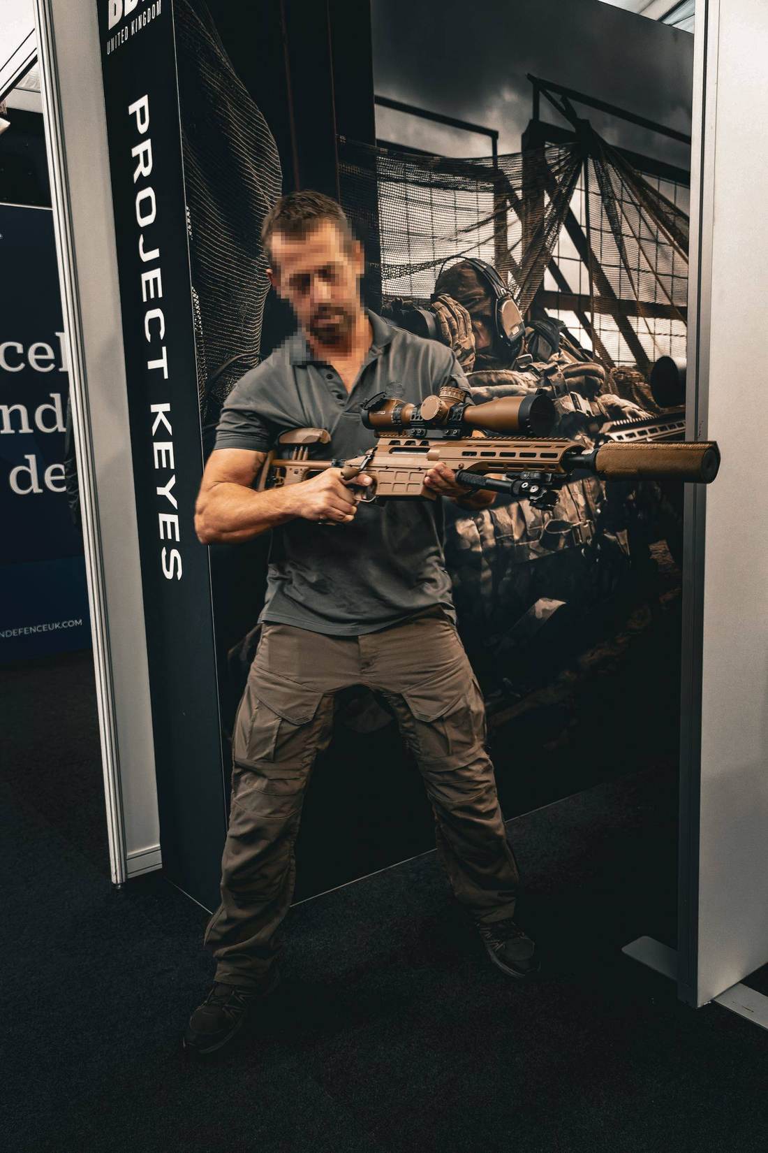 Precision rifle being handled at an exhibition stand