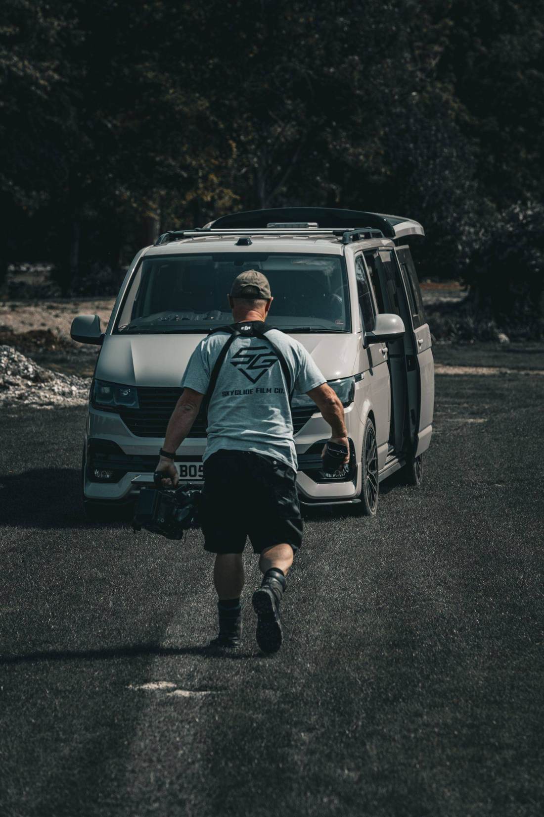 SkyGlide operator carrying a cinema camera back to the crew van